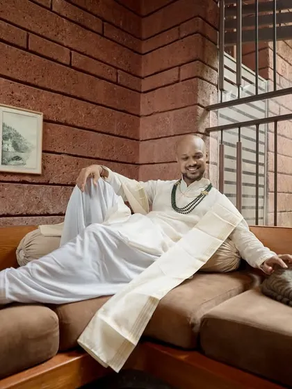 A heartwarming and relaxed portrait of the groom with his furry friend. This image shows a personal, candid side, adding a unique touch to his wedding story.