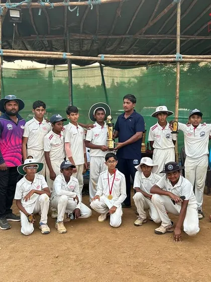 The U-12 team and coaches celebrating their runners-up finish.