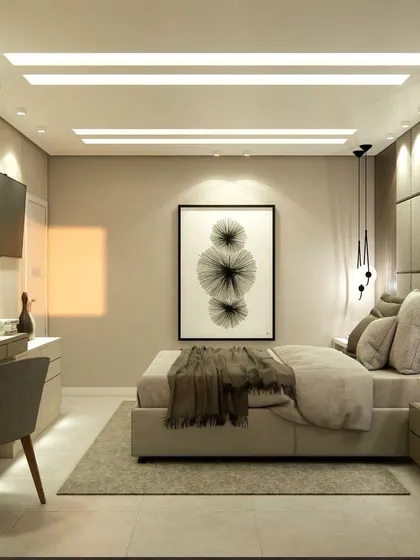 A wide view of the bedroom, showing the bed, dressing table, and the overall spacious layout.