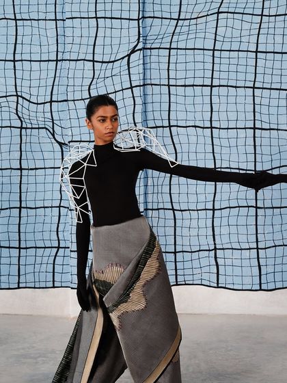 A closer look at the geometric shoulder piece, which was designed to interact with the distorted grid pattern of the backdrop.