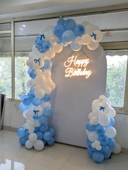 The asymmetrical design of this balloon arch adds a modern and stylish touch to the party decor.