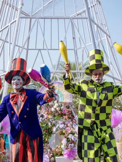 Stilt-walking jesters added to the fun at the lavender-themed carnival. I use professional entertainers to bring a theme to life and create a lively, interactive environment for guests.