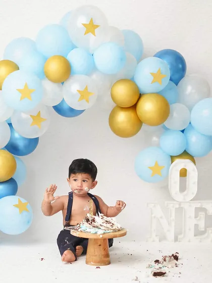 The full cake smash scene, with the happy, messy boy and his destroyed cake. It's a perfect celebration of turning one.