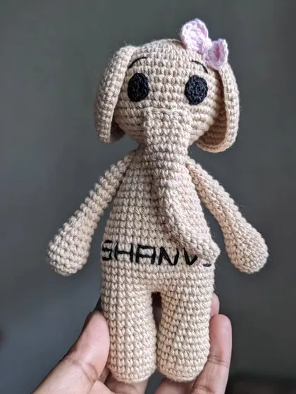 A full view of the personalized elephant doll.