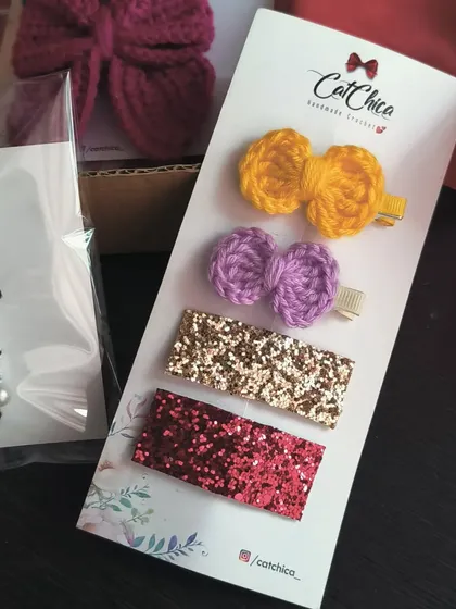 A fun and sparkly clip set. This one includes two small crochet bows and two glitter barrettes, offering the best of both worlds.