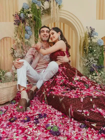 These are the moments that truly matter. Amidst the grandeur, we create space for pure, unscripted joy, like the simple bliss of a couple wrapped in laughter and a shower of flower petals.