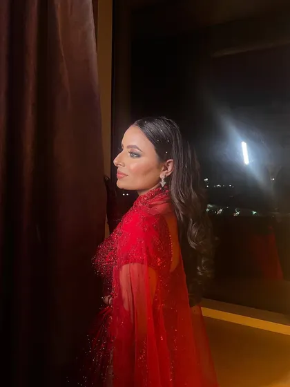 A side view of the hairstyle, showing how the crystal pins catch the light. This is a great way to add glam to a simple style.