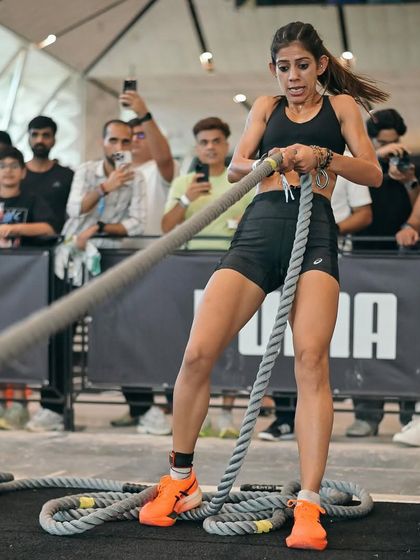 Focused and in the zone during a HYROX competition. This is me on the SkiErg, a full-body cardio machine that tests your endurance and power, a key station in our hybrid training.