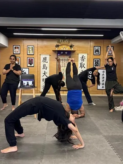 Flexibility and mobility are just as important as strength. In our classes, we dedicate time to deep stretches and poses like the wheel pose and headstands to improve your range of motion, aid in recovery, and create a balanced, resilient body.