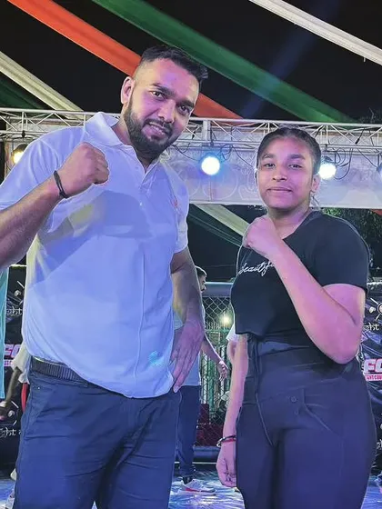 Never give up. Posing with a young female fighter after her competition. She has a bright future.
