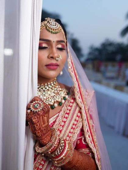 My beautiful bride Urvashi, looking serene and elegant on her wedding day. Her portrait mehendi is just visible on her hand.