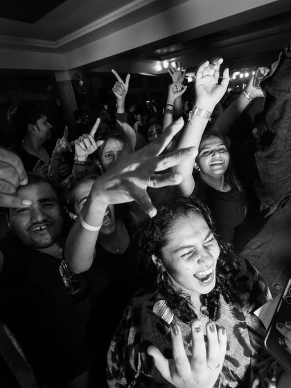 The energy of the crowd is everything. This black and white shot captures the pure joy and excitement of a night where the music just takes over.