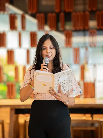 A smiling poet shares her story of vulnerability. The event was a powerful reminder of the strength in being open.