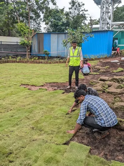 Even challenging conditions like Mumbai's rains don't stop us. Our dedicated team is seen here working on a massive 9,000 square foot lawn installation, ensuring the ground is perfectly prepared for a beautiful result.