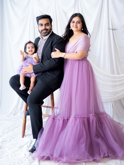 A formal family portrait with everyone dressed in lovely shades of purple. My studio can be set up with simple backdrops for a classic, timeless look.