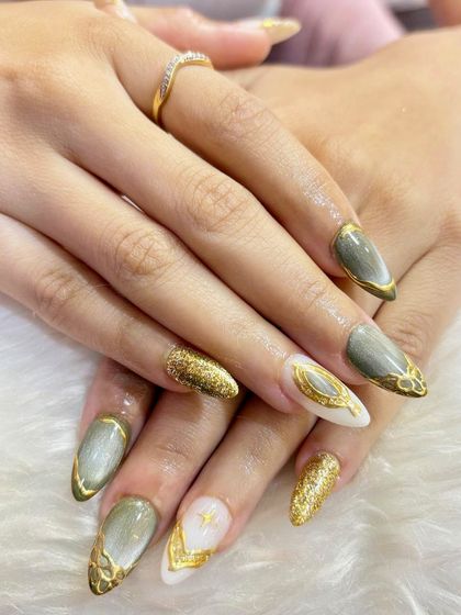 A different view of the olive and gold bridal set, highlighting the beautiful cat-eye effect and the intricate gold detailing that makes these nails so luxurious.