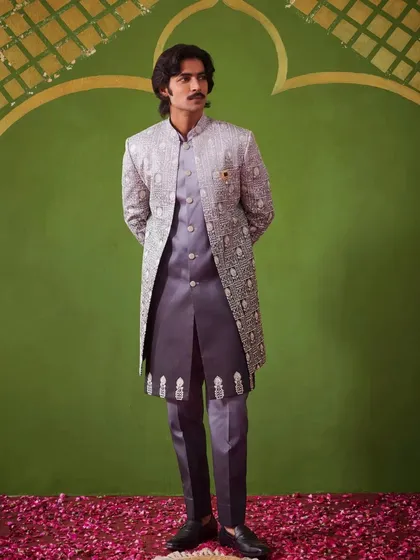 A full-length shot of the grey Indo-Western outfit. The ombre embroidery and the matching inner kurta create a cohesive and stylish look, perfect for a wedding reception.