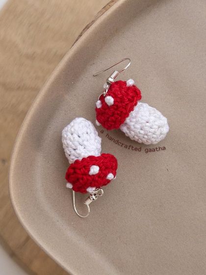 My versatile mushroom earrings! This product shot shows the cute, 3D design of these little toadstools.