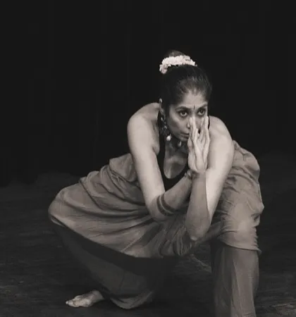A black and white portrait of our director, Himani Khurana, during the "SAMVIT" performance. The intensity and emotion of Kalaripayattu is captured in her expression.