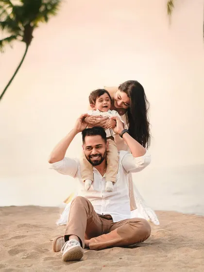 Another beautiful family portrait from a beach session, capturing the joy and connection between parents and their child against a serene ocean backdrop.