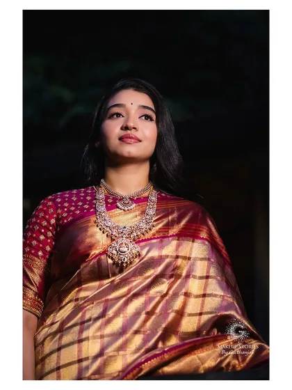 Priyanka for her post-wedding reception. We continued with a soft and natural makeup theme, pairing her beautiful silk saree with a subtle smoky eye and a nude lip for an elegant evening look.