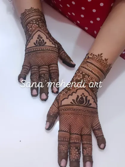 A beautiful back-hand design with a central lotus motif, perfect for someone who wants an elegant and visible design.