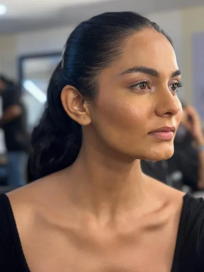 A no-filter shot of the model backstage. This shows the clean, minimal makeup I created for the Gaurav Gupta show, focusing on a natural, healthy skin finish.
