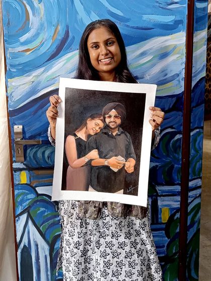 Me holding the finished portrait in my studio.