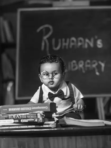 A classic black and white portrait from a 'little scholar' shoot, giving it a timeless and sophisticated feel.