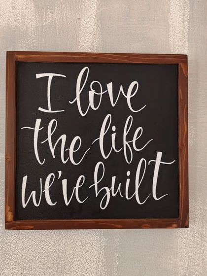 A simple reminder of what truly matters. This hand-painted wooden sign, "I love the life we've built," is a beautiful piece of gratitude to display in your home.