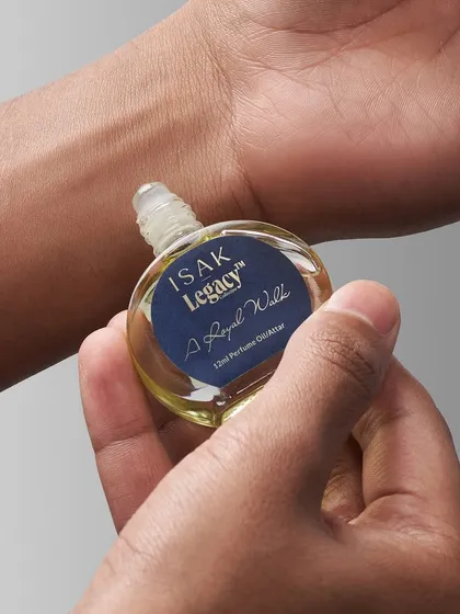 Showing the product in use. This shot for Isak Legacy focuses on the application of the perfume oil, adding a human touch and highlighting the personal nature of fragrance.