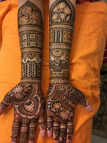 This design showcases a variety of patterns, from floral bands and geometric grids to peacock and lotus motifs, demonstrating our versatility in bridal art.