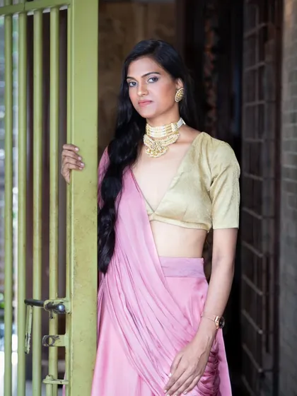 This portrait focuses on the styling of a modern ethnic look, from the statement choker necklace to the metallic blouse. I compose these shots to give equal importance to the garment, accessories, and the model's expression.