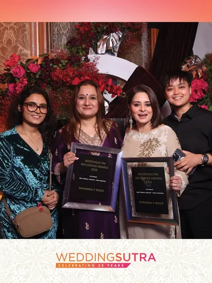 A group of award winners posing with their trophies at the WeddingSutra event. Our high-resolution images are perfect for capturing important moments at industry galas and award ceremonies.