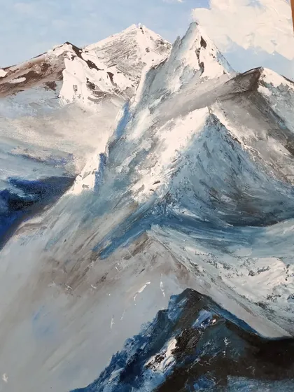 A finished painting of snow-covered mountains, showcasing the use of a palette knife to create sharp, textured peaks.