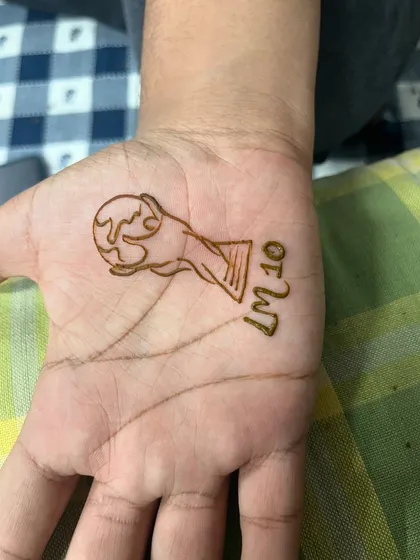 A fun request for a football fan, a simple design of the World Cup trophy with "LM10" for Lionel Messi.
