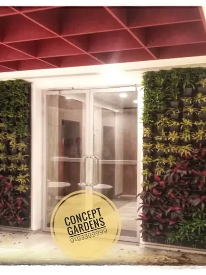 This is an example of how natural vertical gardens can transform a corporate entrance. We flanked this doorway with two floor-to-ceiling living walls, using a rich palette of red and green plants to create a dramatic and welcoming atmosphere.