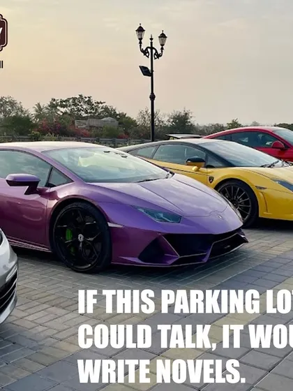 Our parking lot tells a thousand stories. This shot captures a colorful lineup of luxury sports cars, including a purple Lamborghini and a yellow Ferrari.