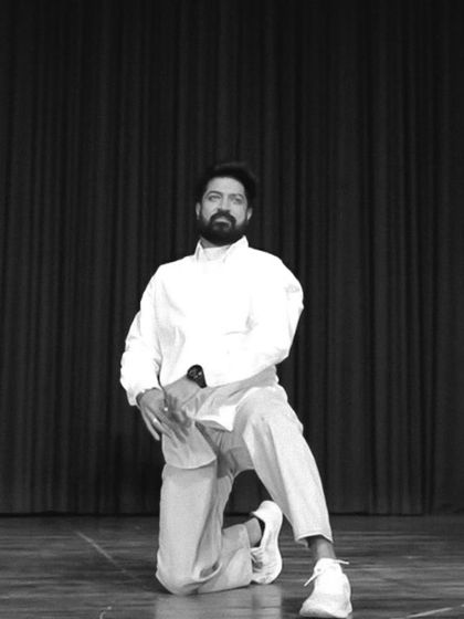 A pose on stage, a place that once scared me but now feels like home. I surrendered to the process of learning and practicing to build my confidence.