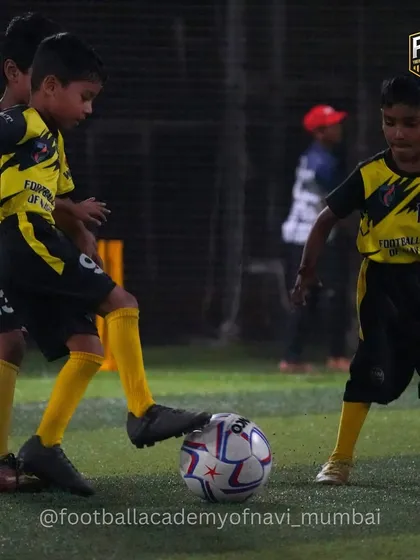 Young players swarm the ball, learning about pressing and teamwork in a fun, game-like scenario.