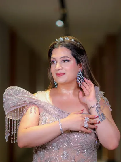 This bride's look is all about grace and glow. Her subtle makeup features untouched-looking skin and softly defined eyes, enhancing her natural charm.
