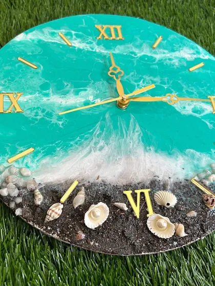 Another angle of the turquoise ocean clock, showing the beautiful contrast between the water, waves, and sand.