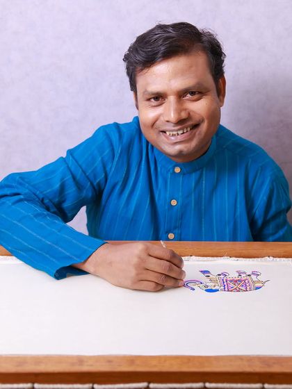 Our embroidery artisan, Mukhtaar ji, ensuring every detail of a client's story is conveyed perfectly through his craft. He dives into the depths of detail to bring your vision to life.