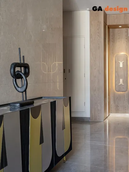 The finished custom console in its intended space. The abstract design of the shutters and the sleek lines of the piece make it a true statement of craftsmanship.