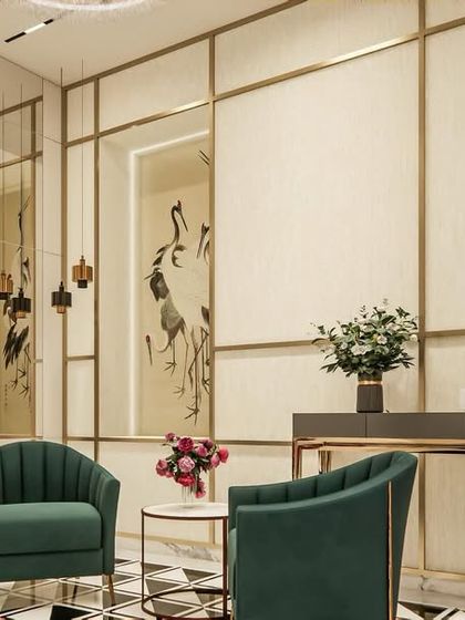 This seating nook demonstrates how to create intimate moments within a larger space. The use of bold, emerald green chairs against a backdrop of geometric patterns and reflective surfaces adds a touch of personality and curated style to the home.