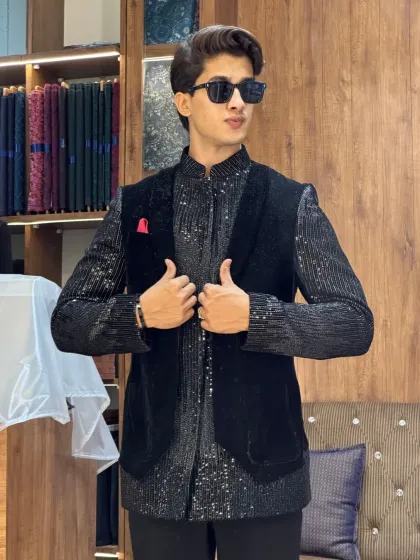 Confidence is the best accessory. A client looking sharp in the black sequined kurta and velvet waistcoat, ready for any party.