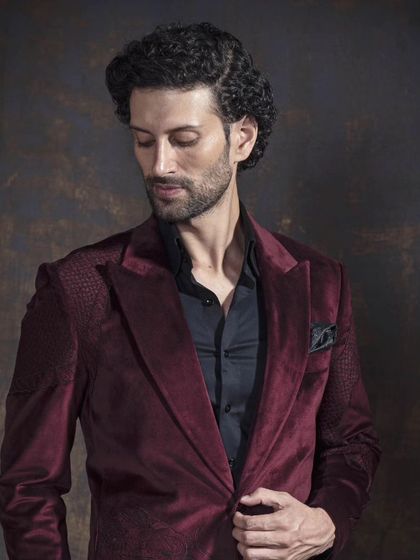 Another angle of the maroon velvet blazer, showing its structure and fit. A piece like this speaks sophistication without saying a word.