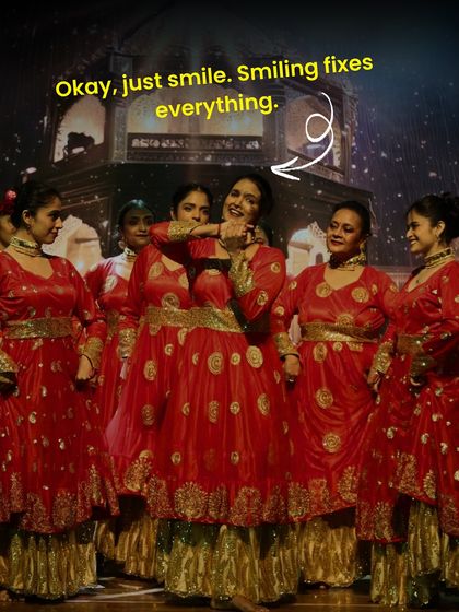 "Okay, just smile. Smiling fixes everything." A funny and true moment captured on stage. When in doubt, a confident smile can make all the difference.