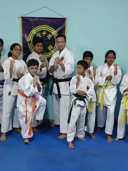 A group of my students, representing a range of belt levels, after a grading ceremony. The mix of ranks shows a path of continuous learning and improvement.