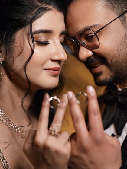 A romantic close-up of the couple. This shot highlights her beautiful eye makeup and soft features.